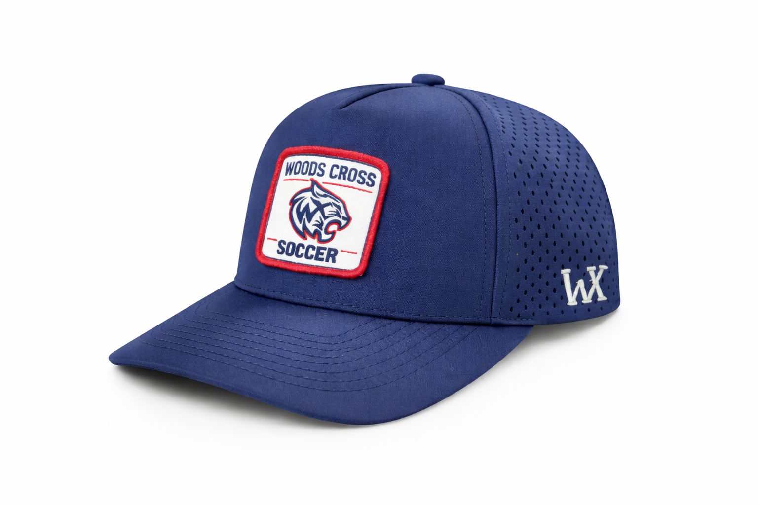 Navy blue performance cap with Woods Cross Soccer patch